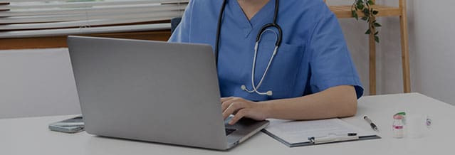 Veterinarian or animal nurse is using a laptop to collect veterinary history and recommend a medical diagnosis in a hospital, Save animals, Care and treatment